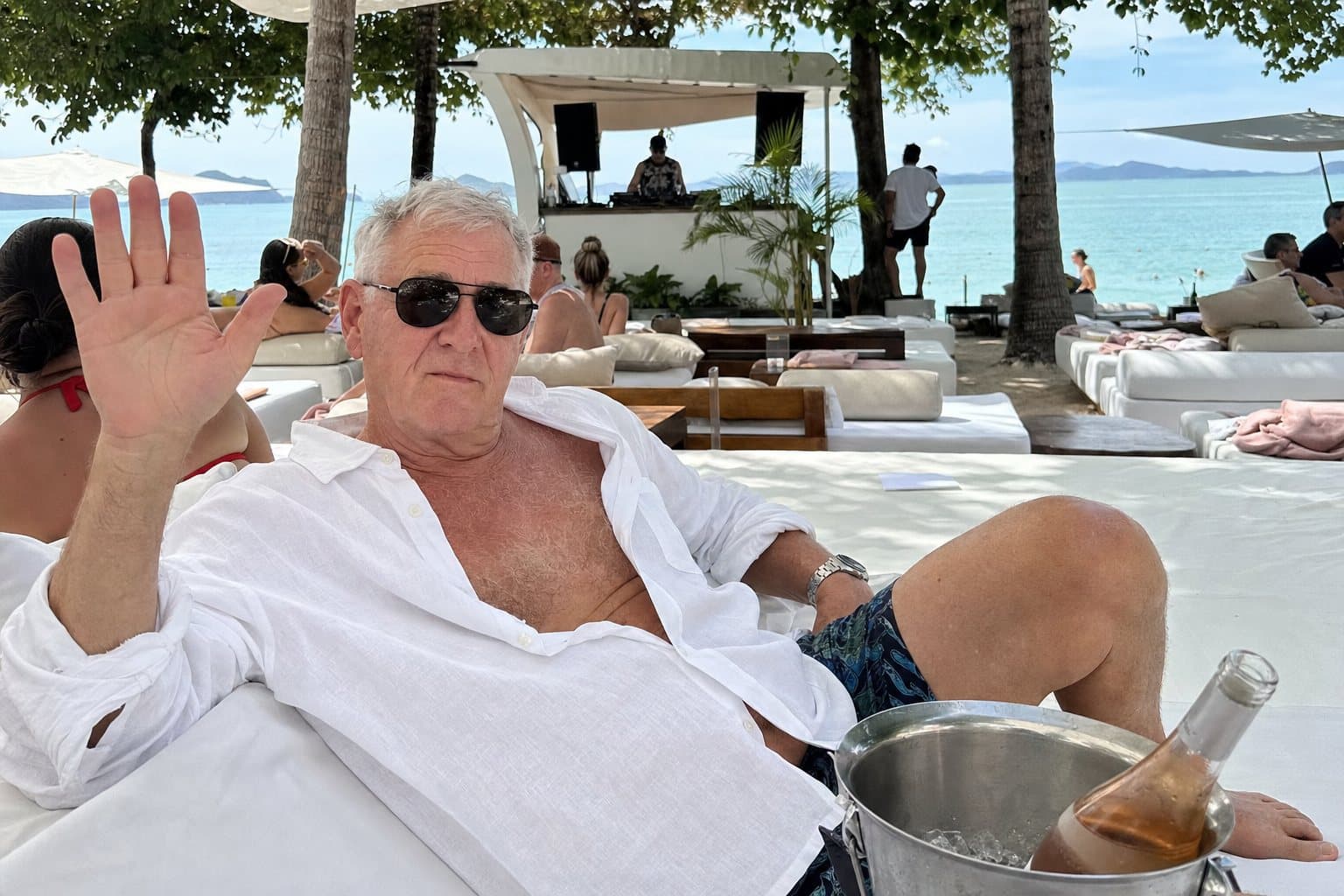 Tim on a daybed at a beach club